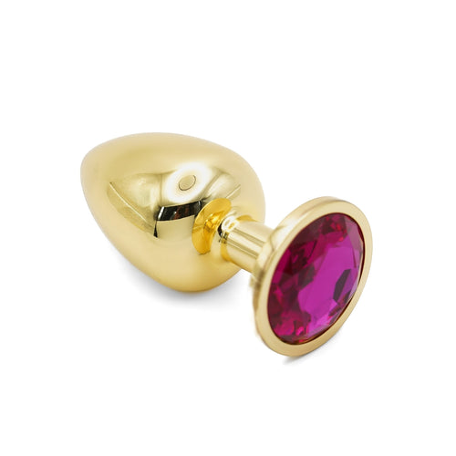 Get Closa large gold metal butt plug with a polished finish and a vibrant pink jewelled base on a white background