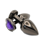 Get Closa large black metal butt plug with a polished finish and a decorative purple heart-shaped jewel base