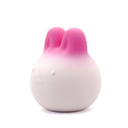 Get Closa pink gradient bunny-shaped silicone vibrator with a soft squeezable body and cute minimalist facial features.